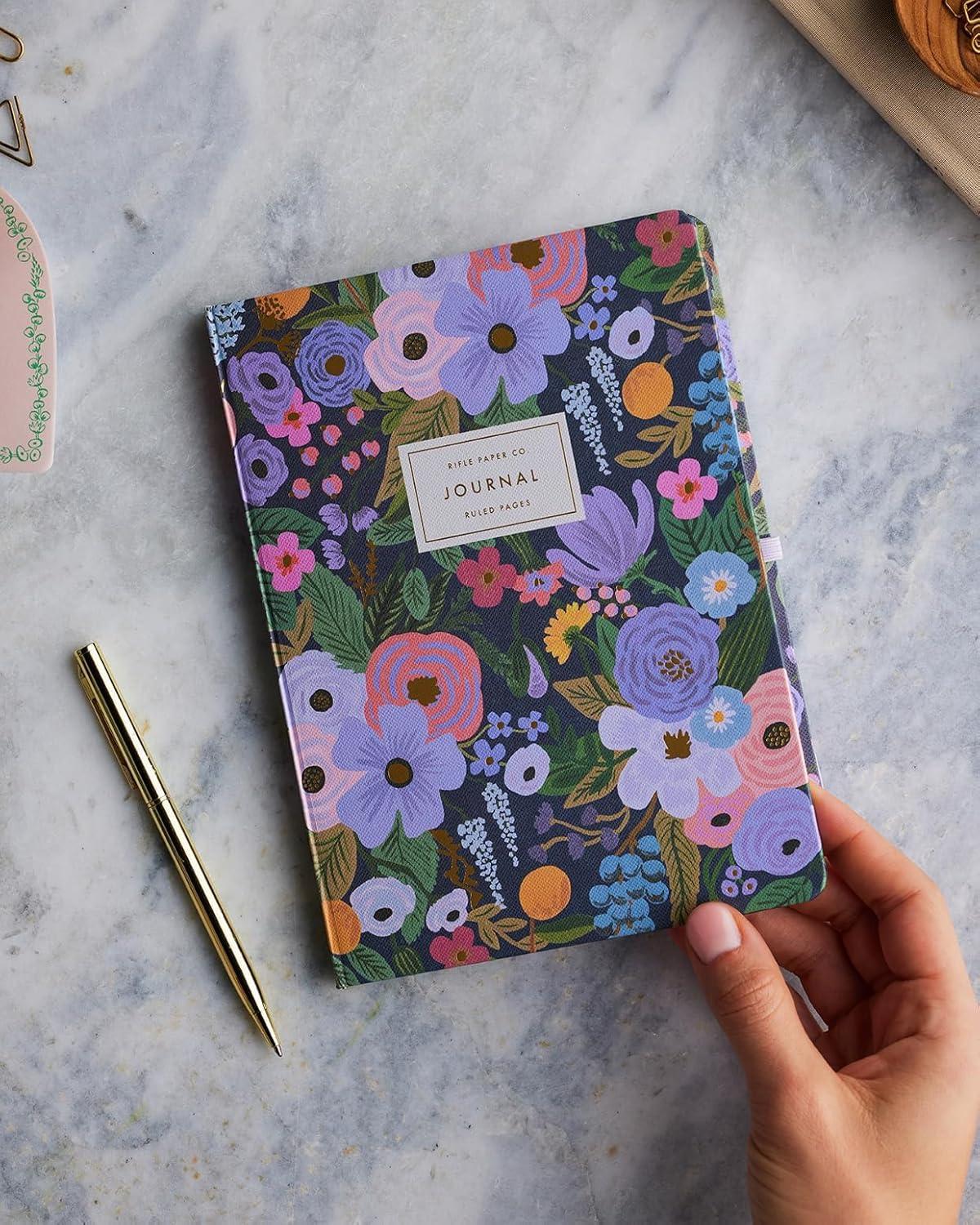 imageRIFLE PAPER CO Journal with Pen Hardcover Journal with Foil Accents 144 Pages Elastic Band Closure Pocket for Extra Storage Patterned in Floral RosaViolet Garden Party